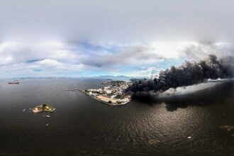 Após incêndio em fábrica, Inea teme vazamento de óleo na Guanabara